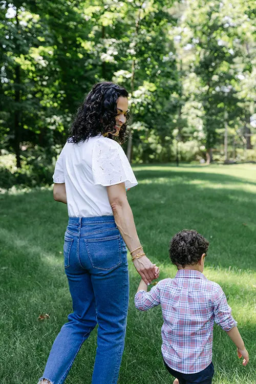 Cristina Savin, founder of Sweet Bear Coffee walking with son Teddy. Image